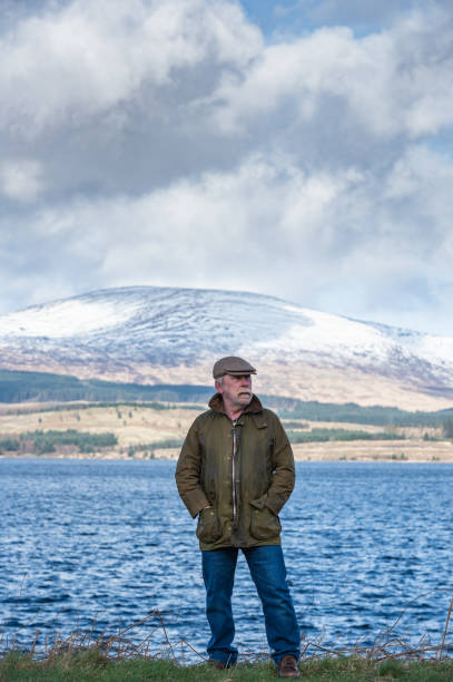 istock Active senior man at the edge of a loch 1133671196