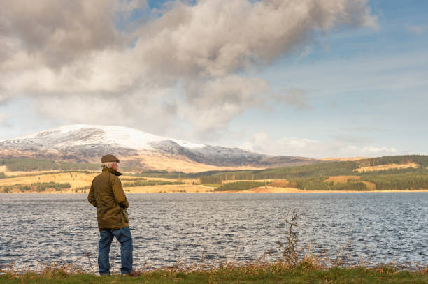 istock Active senior man at the edge of a loch 1133671224
