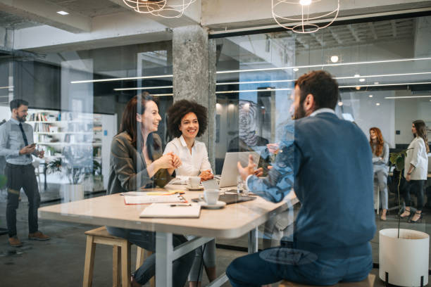 istock Group of business people talking while having meeting in the office. 1133671473