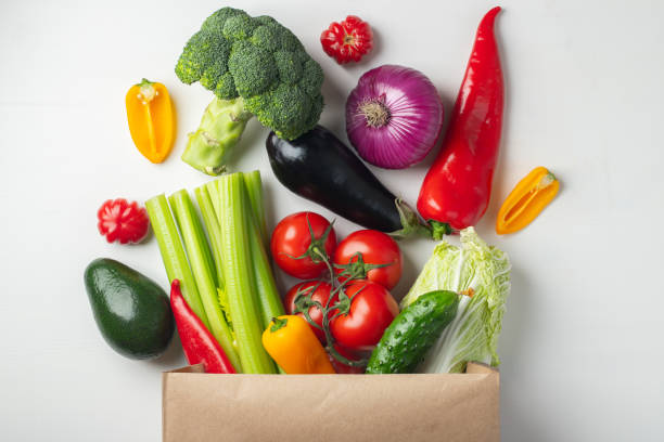 istock Paper bag with vegetables on white background. 1133672390