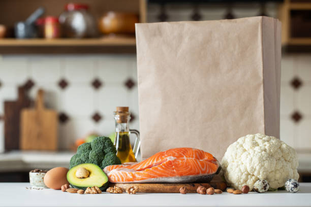 istock Fresh vegetables, fruits, nuts and salmon steak. 1133672404