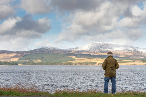istock Active senior man at the edge of a loch 1133672482