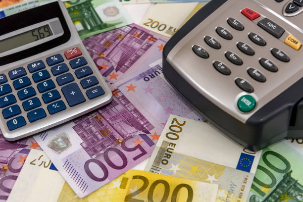 istock Banking terminal on euro banknotes background close up 1133672586