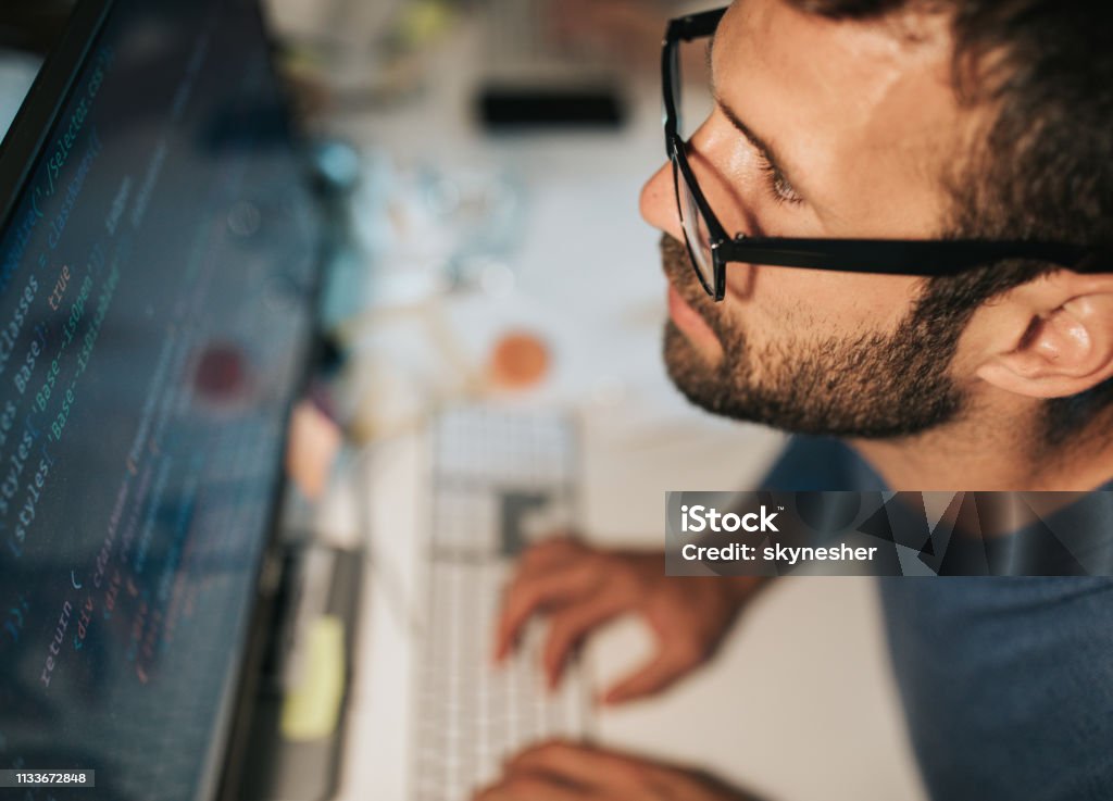 Concentrated Programmer Reading Computer Codes On Desktop Pc Stock ...