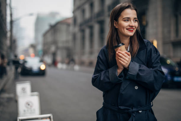 istock Young woman is drinking takeaway coffee 1133674086