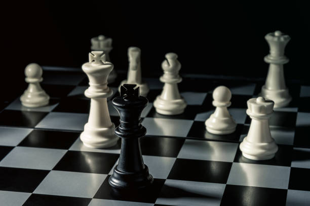 istock Chess board. Black king threatens white opponent's chess 1133678584