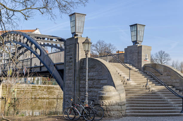 Pedestrian steel bridge Gerickesteg over the river Spree in Berlin, Germany Berlin, Germany - February 17, 2019: Pedestrian steel bridge Gerickesteg over the river Spree with its staircase parapets raised on the bridge side like a pillar and crowned with an Art Nouveau gas lantern moabit stock pictures, royalty-free photos & images