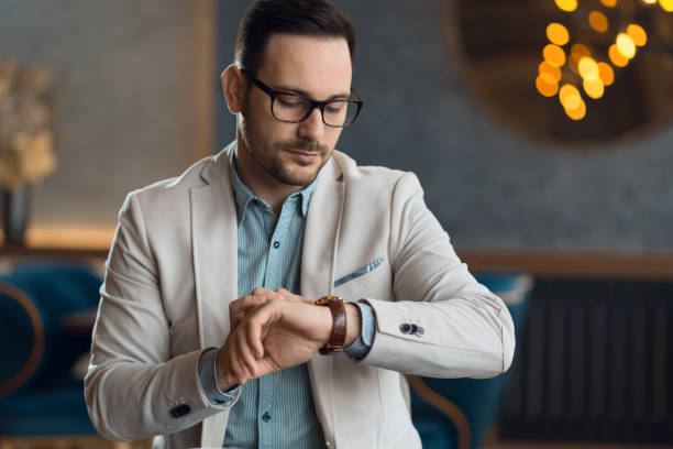 istock Shot of a businessman checking the time while sitting in a cafe 1133678697