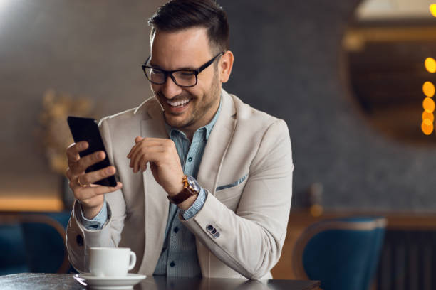 istock Young businessman text messaging on cell phone. 1133678760