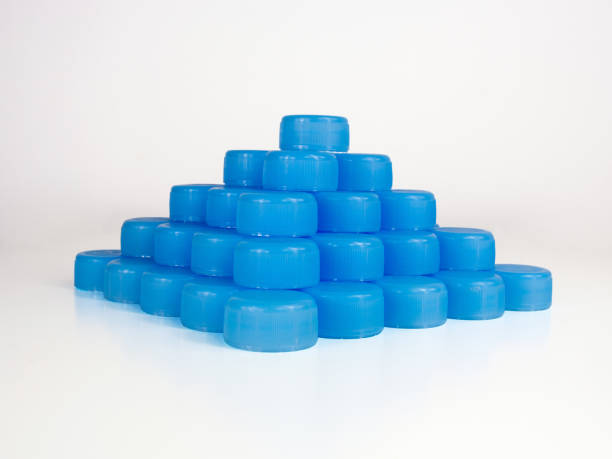 A pyramide made of plastic caps. A pyramide made of plastic caps. A concept showing the use of plastic. utilize stock pictures, royalty-free photos & images