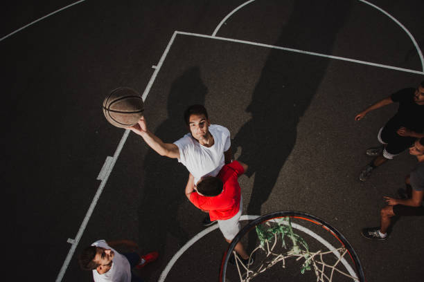 istock Group of friends playing basketball 1133685380
