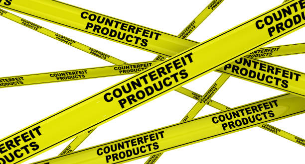istock Counterfeit products. Yellow warning tapes 1133685618