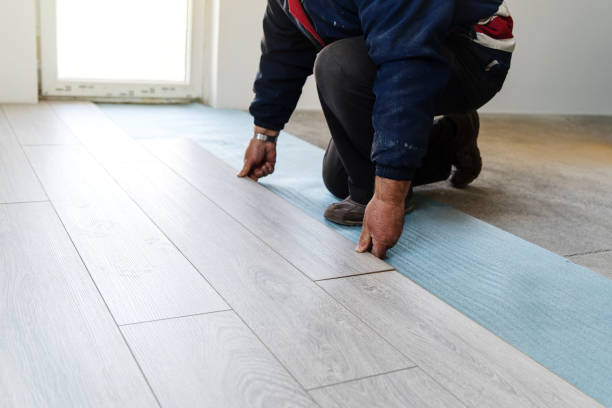 istock Professional worker Installing wooden laminate flooring home renovation 1133685661