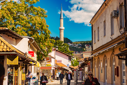 Sarajevo, Bosnia and Hercegovina – September 26, 2018: Street Bravadžiluk in Baščaršija – Old Town of Sarajevo, Bosnia and Hercegovina is one of the oldest streets in Sarajevo with many old craft shops selling unique dishware, coffee sets, souvenirs, with famous food and coffee shops and much more.