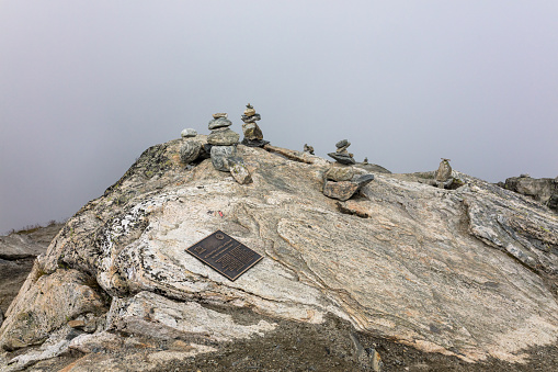 Memorial plaque on stones of observation deck of Dalsnibba, Geiranger. Dalsnibba is a mountain in Stranda Municipality in More og Romsdal county, Norway. It is located at the end of the Geiranger valley, about 7 km (4 mi) south of the village of Geiranger and the Geirangerfjorden, it offers a good view and is therefore a popular tourist destination.