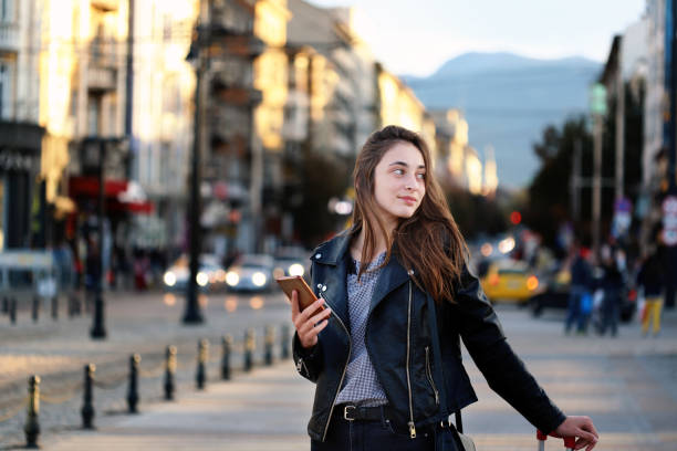 istock Beautiful  young girl using smart phone 1133692542