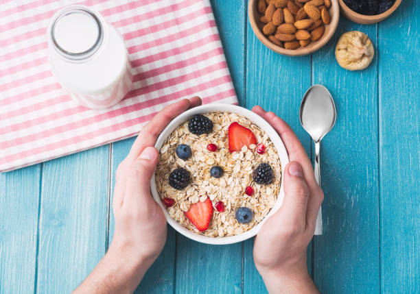 istock Man preparing to eat muesli 1133694701