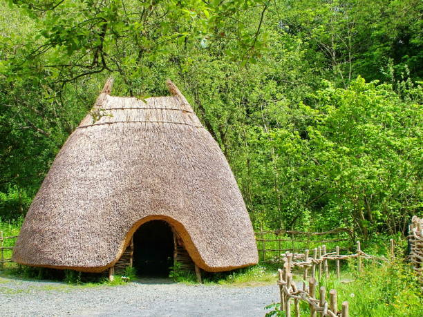 Ancient man hut. Teepee or wigwam tent house, outdoors. Prehistoric house from skins leather.