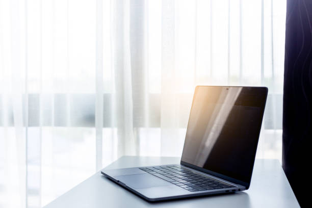 istock Office workplace with laptop on white table , white office desk 1133699530