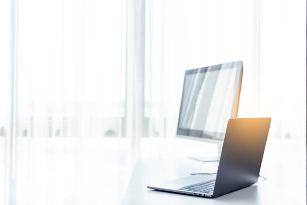 istock Office workplace with laptop on white table , white office desk 1133699596