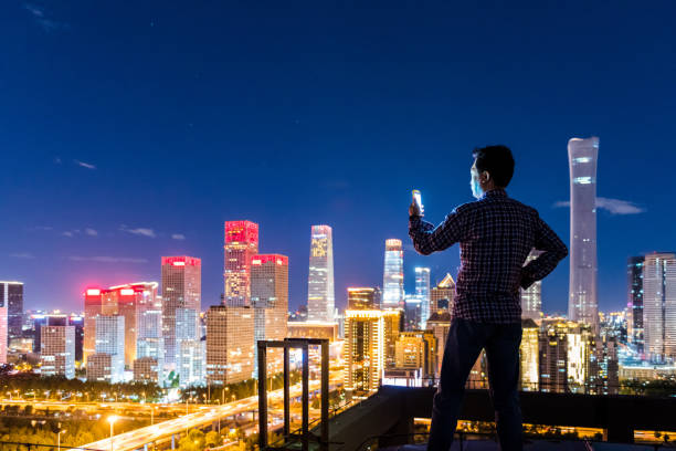 istock Business man with Smart Phone on rooftop 1133702397