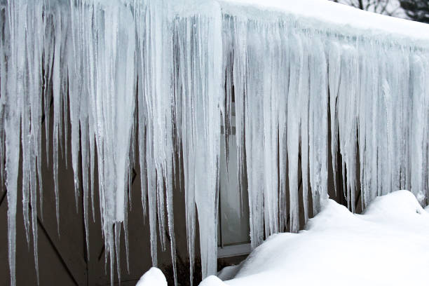 istock Icicles hanging off of the roof 1133703426