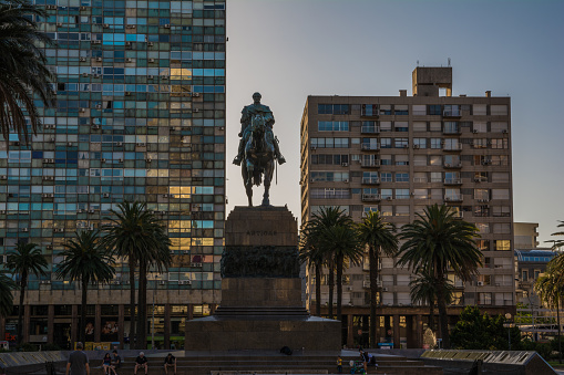 Monumento to Artigas between two buildings. This monument was created in 1923 and is located in Independencia Square. January 05, 2019. Montevideo - Uruguay.