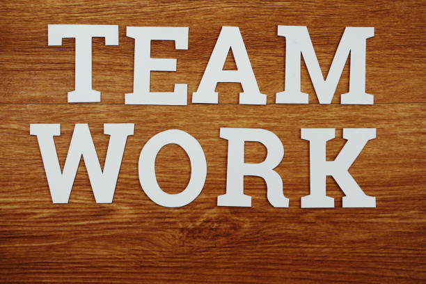 istock Teamwork text letters alphabetTop view on wooden background 1133706951