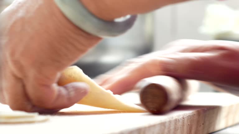 Mother cooks and makes dumplings
