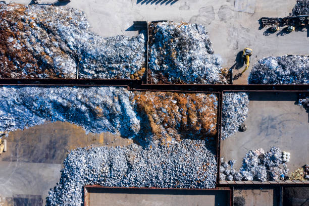 Aerial photograph of waste disposal site. Large amounts of iron scraps.
Many excavator cars are in operation. large dumpster stock pictures, royalty-free photos & images