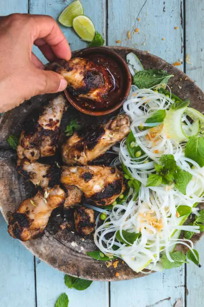 Photo of Grilled chicken with lemongrass and noodle and pea salad