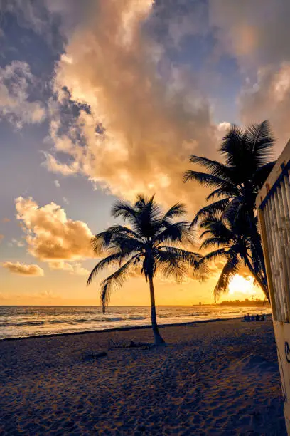 Photo of Sunset and sunrise golden hour clouds over beach horizon, Caribbean, Hawaii paradise