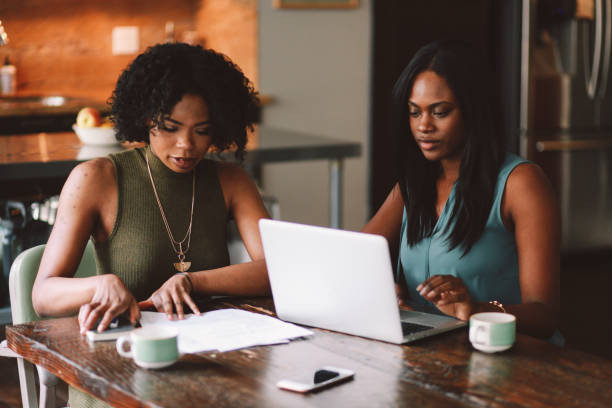 istock Two young women working together on a project in their LA apartment 1133713789