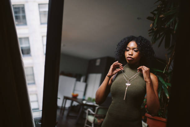 Young woman at her apartment getting ready to go out