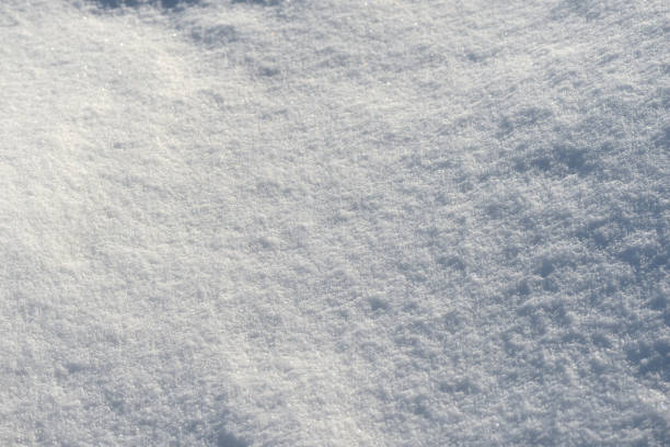 istock White snow texture on a sunny day. Winter background 1133717662