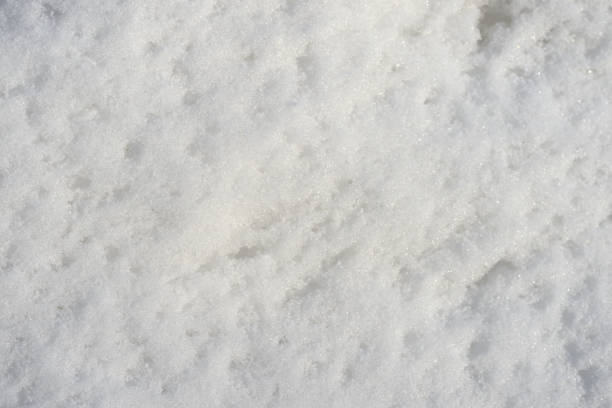 istock White snow texture on a sunny day. Winter background 1133717680