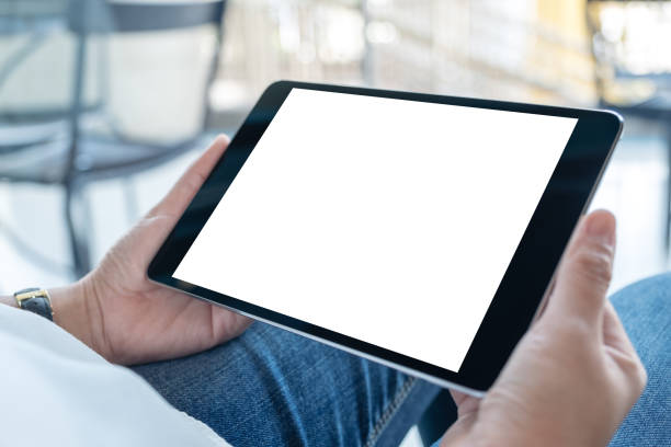 istock a woman holding black tablet pc with blank white screen 1133718491
