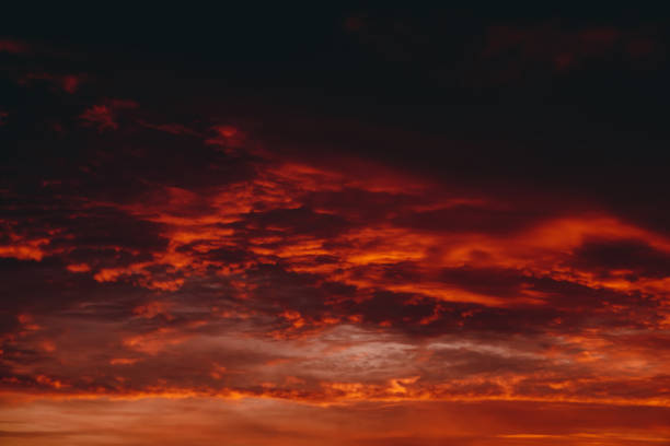 istock Fiery red blood vampire dawn. Amazing warm dramatic fire cloudy sky. Vivid orange sunlight. Atmospheric background of sunrise in overcast weather. Hard cloudiness. Storm clouds warning. Copy space. 1133719607