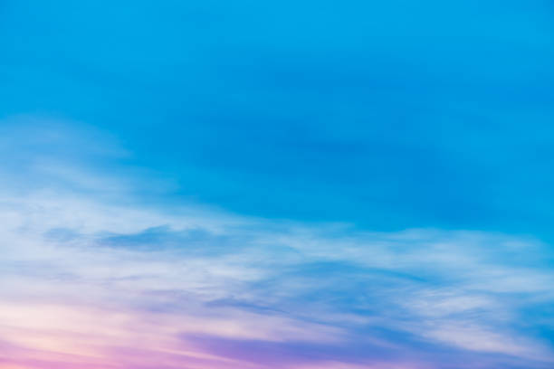 istock Sunset sky with pink lilac light clouds. Colorful smooth blue white sky gradient. Natural sunrise background. Amazing heaven at morning. Slightly cloudy evening atmosphere. Wonderful weather on dawn. 1133719622