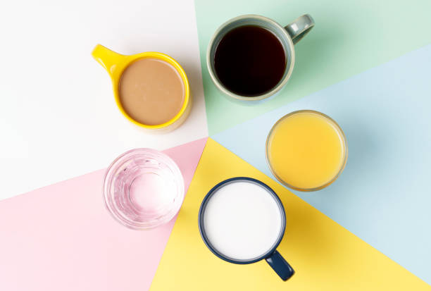 istock Coffee tea and other drinks in colorful cups on a white background, top view 1133719815