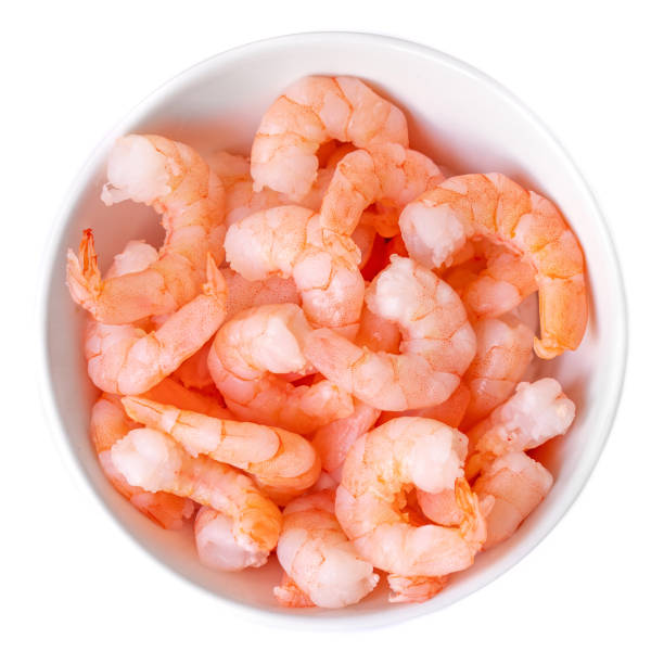 istock Peeled shrimps in a bowl isolated on white background. Top view 1133723245