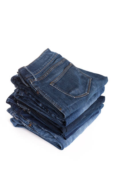 istock A stack of clothes jeans pants on a white background. Isolation 1133724694
