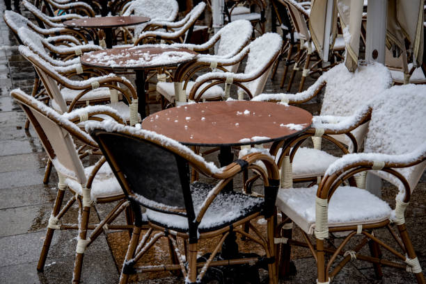 istock Outside cafe chairs and tables in snow in Dresden, Germany 1133724934