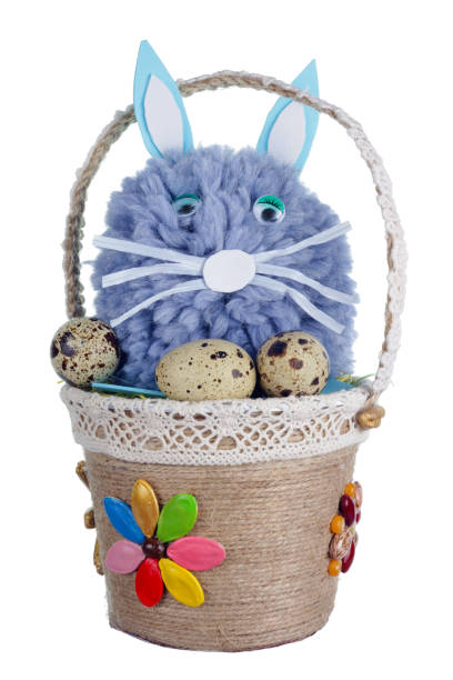 istock Easter handmade  basket  from  rope with  lonely sad  blue bunny   and eggs. Isolated 1133725735