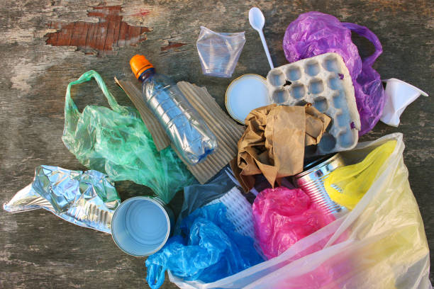 istock Garbage bag with different trash on wooden background. Top view. Flat lay. 1133727657