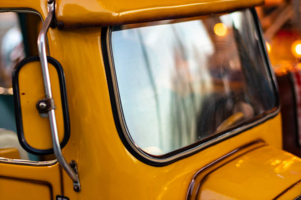 istock Yellow toy car with windshield reflection in a carousel 1133728785