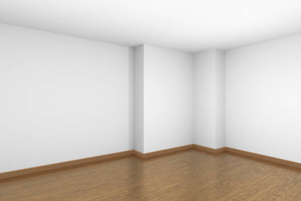 istock White empty room with brown wood parquet floor 1133729540