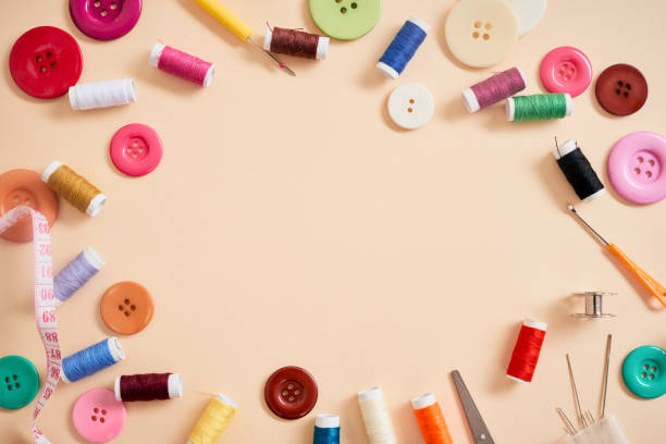 istock tools for needlework thread scissors and tape measure isolated on biege background 1133733356