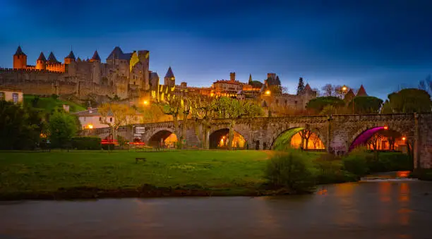 Night view over illuminated fortification of Carcassonne, France. Famous medieval city with beautiful night illumination.