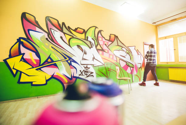 istock Man drawing street art graffiti 1133735556